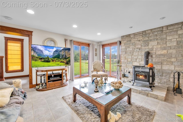 9000 Ferry Rd, Grosse Ile, MI 48138 - tiled living room featuring a wood stove and recessed lighting