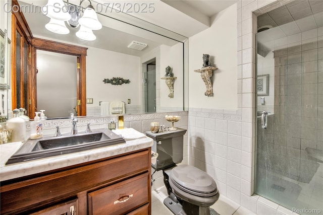 9000 Ferry Rd, Grosse Ile, MI 48138 - bathroom featuring tile walls, a shower stall, vanity, a chandelier, and wainscoting