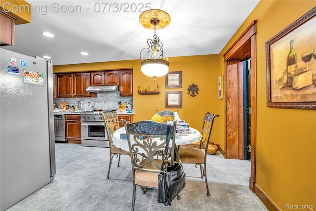 9000 Ferry Rd, Grosse Ile, MI 48138 - dining room with recessed lighting and light tile patterned floors
