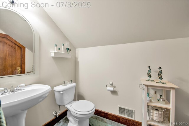 9000 Ferry Rd, Grosse Ile, MI 48138 - half bathroom featuring lofted ceiling and a sink
