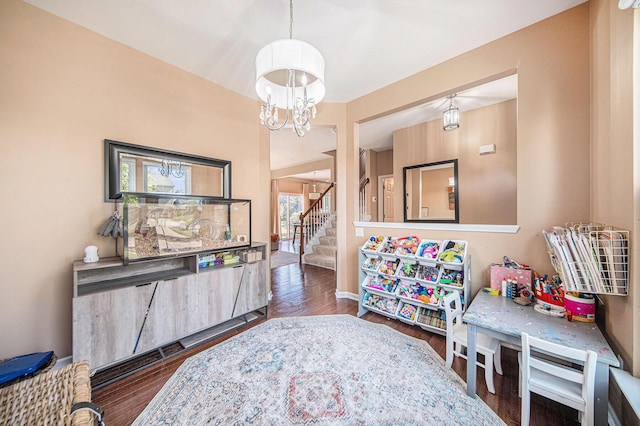 440 Shiloh Dr, Chelsea, MI 48118 - playroom featuring a chandelier and wood finished floors