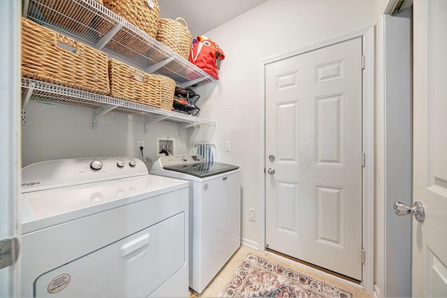 440 Shiloh Dr, Chelsea, MI 48118 - laundry area with washer and dryer and light tile patterned flooring