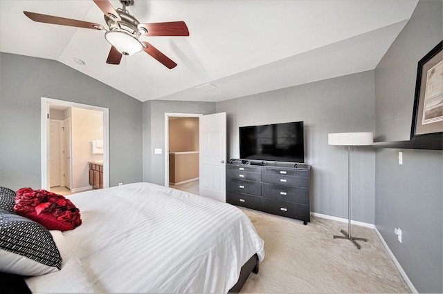 440 Shiloh Dr, Chelsea, MI 48118 - bedroom featuring vaulted ceiling, light carpet, ceiling fan, and ensuite bathroom