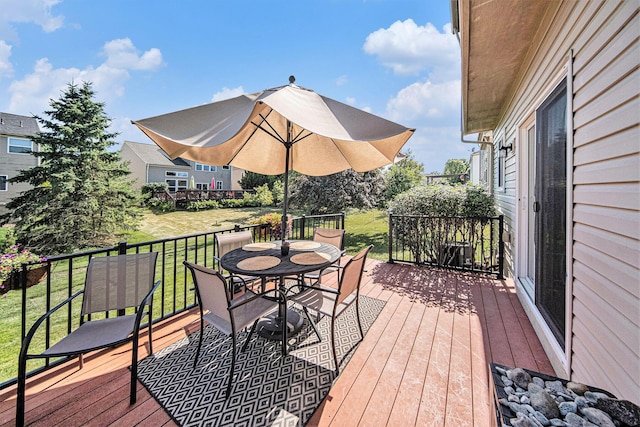 440 Shiloh Dr, Chelsea, MI 48118 - wooden terrace featuring outdoor dining space and a yard