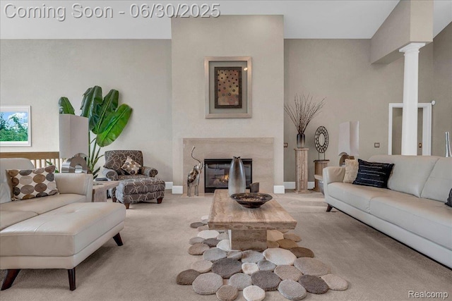550 Kings Fairway Ct, Grand Blanc, MI 48439 - carpeted living area with decorative columns and a fireplace