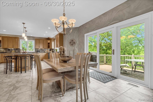 550 Kings Fairway Ct, Grand Blanc, MI 48439 - dining area featuring light marble finish floors, a chandelier, and recessed lighting