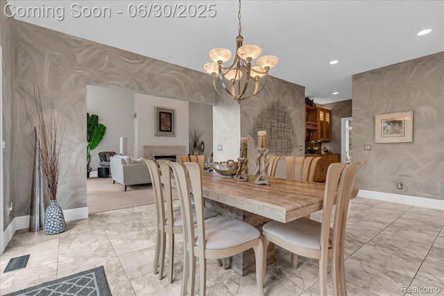 550 Kings Fairway Ct, Grand Blanc, MI 48439 - dining space with wallpapered walls, light marble finish flooring, a chandelier, and recessed lighting