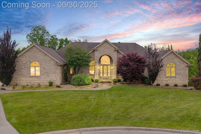 550 Kings Fairway Ct, Grand Blanc, MI 48439 - view of front of property with brick siding and a front lawn