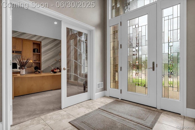 550 Kings Fairway Ct, Grand Blanc, MI 48439 - doorway with marble look tile flooring, healthy amount of natural light, and french doors
