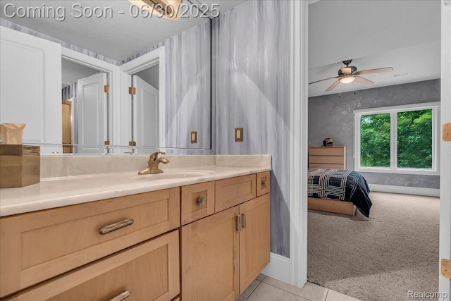 550 Kings Fairway Ct, Grand Blanc, MI 48439 - bathroom featuring vanity, tile patterned flooring, ensuite bath, and ceiling fan