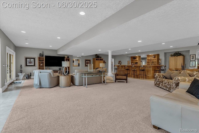 550 Kings Fairway Ct, Grand Blanc, MI 48439 - living room featuring a textured ceiling, recessed lighting, and light carpet
