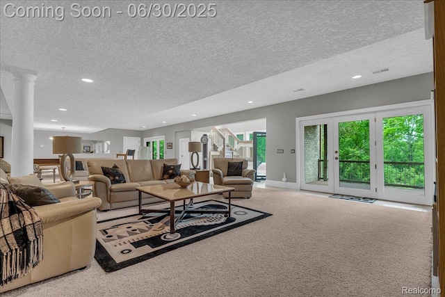 550 Kings Fairway Ct, Grand Blanc, MI 48439 - living area with a textured ceiling, recessed lighting, carpet, and decorative columns