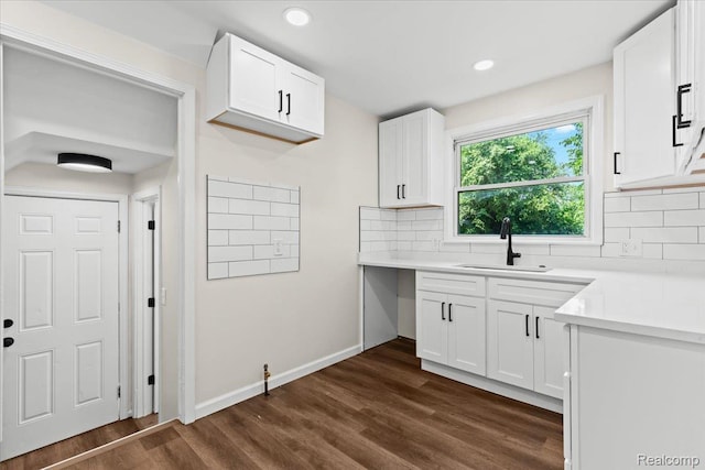 18639 Kentucky St, Detroit, MI 48221 - kitchen featuring decorative backsplash, dark wood-style flooring, white cabinetry, light countertops, and recessed lighting