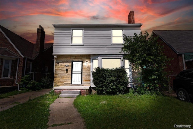 18639 Kentucky St, Detroit, MI 48221 - view of front of house featuring stone siding and a chimney