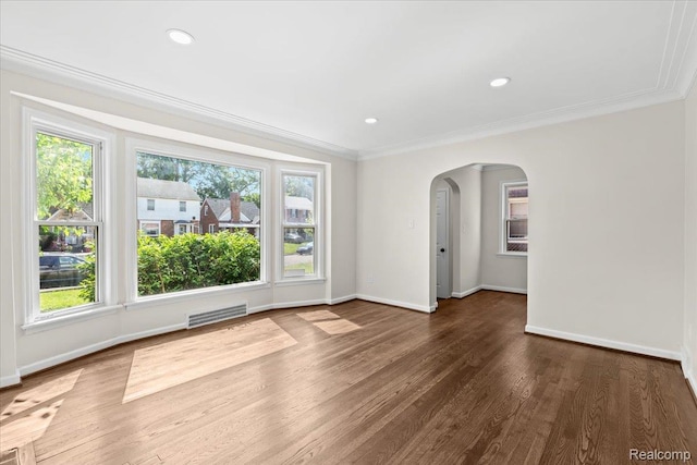 18639 Kentucky St, Detroit, MI 48221 - empty room featuring arched walkways, crown molding, wood finished floors, and recessed lighting