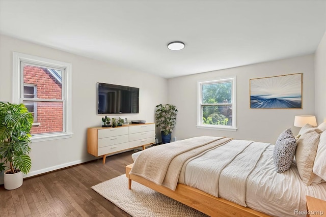 18639 Kentucky St, Detroit, MI 48221 - bedroom featuring multiple windows and wood finished floors