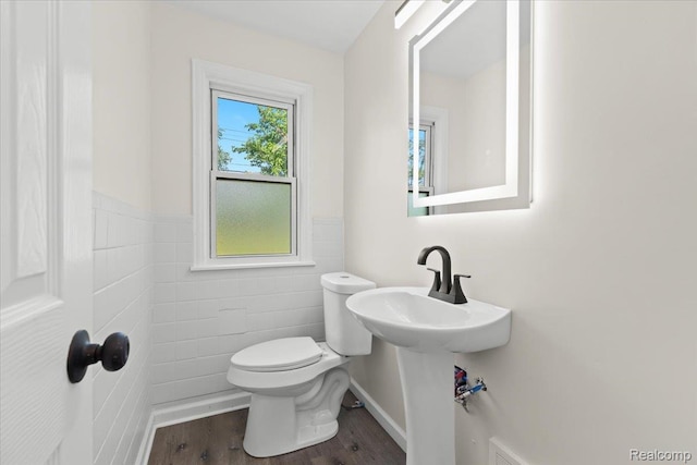 18639 Kentucky St, Detroit, MI 48221 - half bath featuring tile walls, wood finished floors, and wainscoting