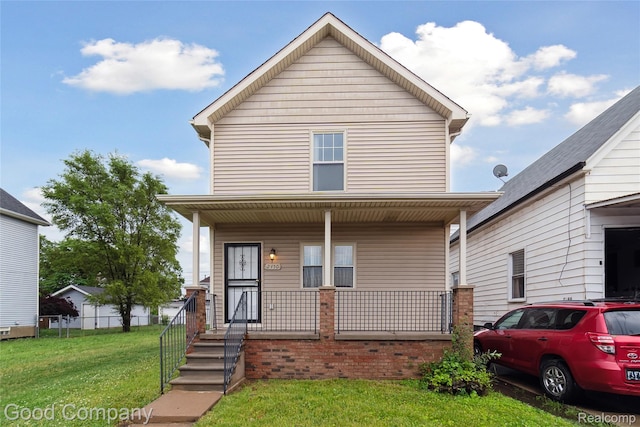 2450 Hewitt St, Hamtramck, MI 48212 - view of front of property featuring a porch and a front lawn