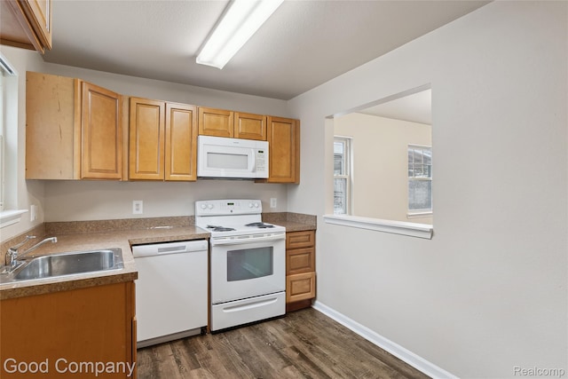 2450 Hewitt St, Hamtramck, MI 48212 - kitchen featuring white appliances and dark wood finished floors