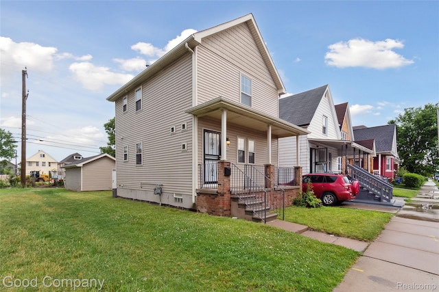 2450 Hewitt St, Hamtramck, MI 48212 - view of front of property with a porch and a front yard