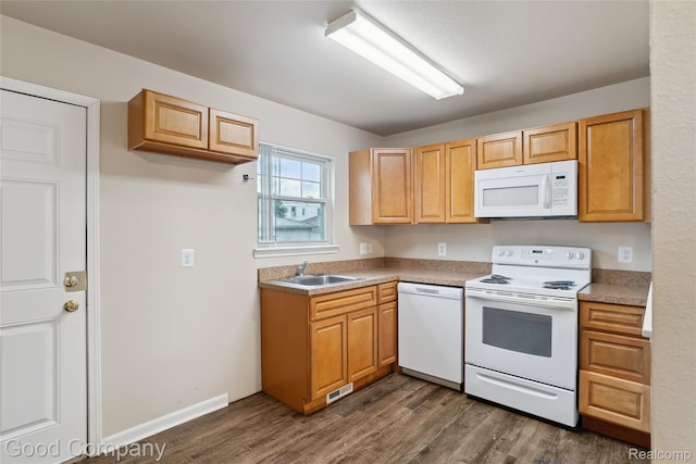 2450 Hewitt St, Hamtramck, MI 48212 - kitchen featuring white appliances and dark wood-type flooring