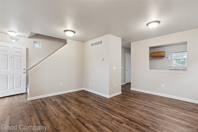 2450 Hewitt St, Hamtramck, MI 48212 - unfurnished room featuring dark wood-style floors and stairway