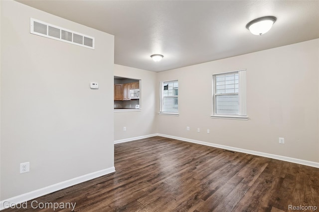 2450 Hewitt St, Hamtramck, MI 48212 - spare room featuring dark wood-type flooring