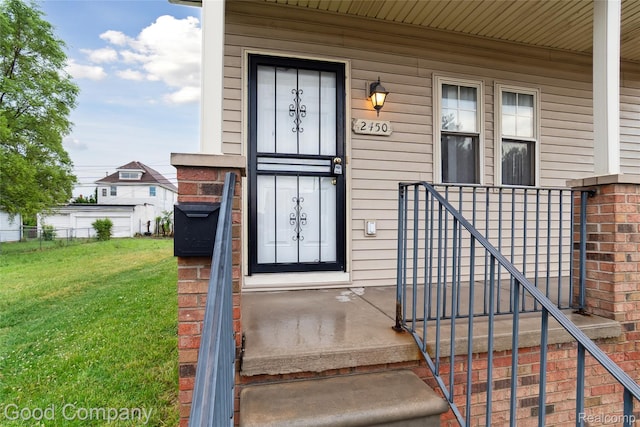 2450 Hewitt St, Hamtramck, MI 48212 - view of exterior entry with a lawn