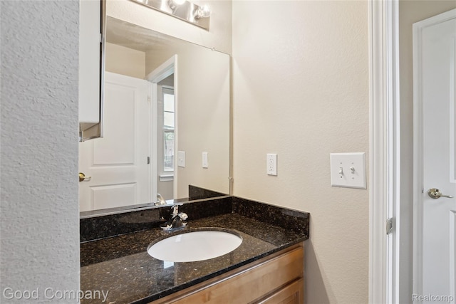 2450 Hewitt St, Hamtramck, MI 48212 - bathroom with vanity and a textured wall