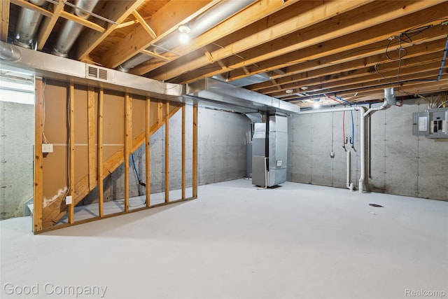 2450 Hewitt St, Hamtramck, MI 48212 - unfinished below grade area featuring heating unit and electric panel