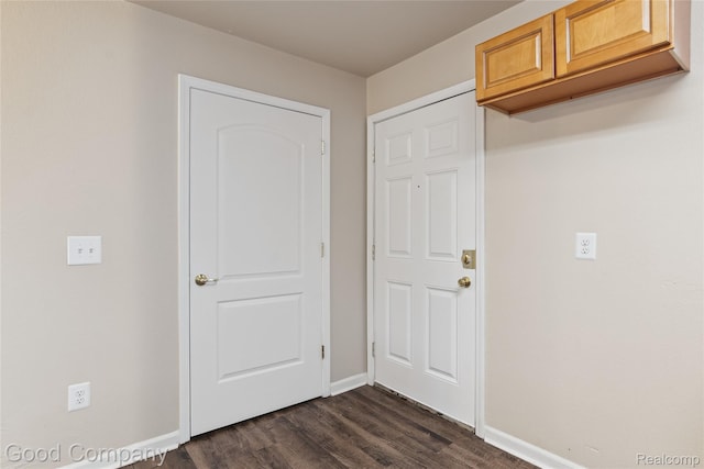 2450 Hewitt St, Hamtramck, MI 48212 - foyer with baseboards and dark wood-style flooring