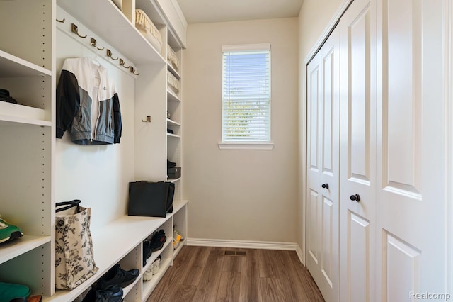 1957 Emerald Ln, Wixom, MI 48393 - mudroom featuring dark wood finished floors and baseboards