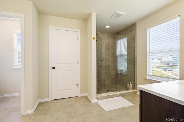 1957 Emerald Ln, Wixom, MI 48393 - bathroom featuring tile patterned floors, a shower stall, and vanity
