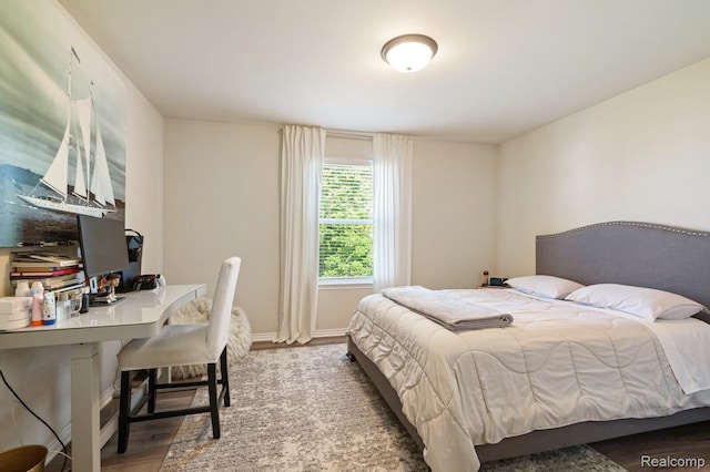 1957 Emerald Ln, Wixom, MI 48393 - bedroom with an office area and wood finished floors