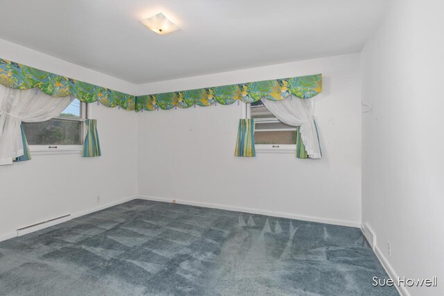 1547 Edith Ave NE, Grand Rapids, MI 49505 - carpeted empty room with a baseboard radiator and baseboards