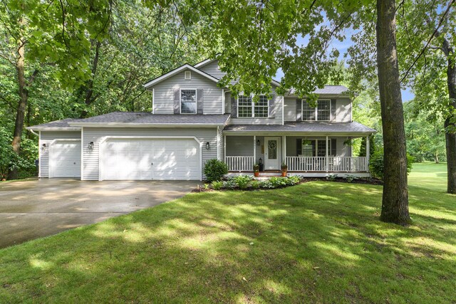 8601 Hathaway Rd, Kalamazoo, MI 49009 - traditional home featuring driveway, covered porch, a front lawn, and a garage