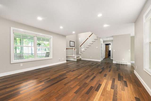 8601 Hathaway Rd, Kalamazoo, MI 49009 - unfurnished living room with stairway, dark wood-style floors, and recessed lighting