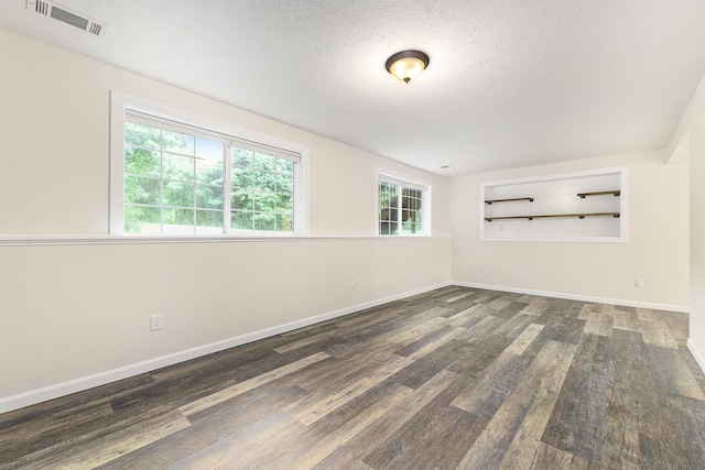 8601 Hathaway Rd, Kalamazoo, MI 49009 - empty room featuring wood finished floors and a textured ceiling