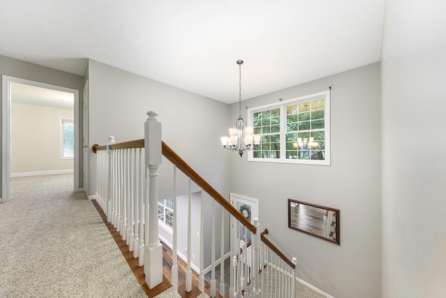 8601 Hathaway Rd, Kalamazoo, MI 49009 - stairway featuring plenty of natural light and a chandelier