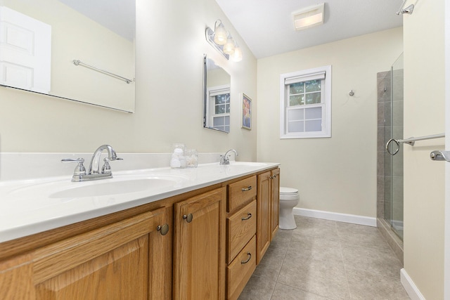 8601 Hathaway Rd, Kalamazoo, MI 49009 - bathroom featuring double vanity, tiled shower, and tile patterned floors