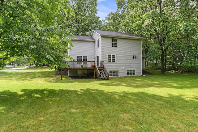 8601 Hathaway Rd, Kalamazoo, MI 49009 - rear view of house featuring stairway, a wooden deck, and a lawn