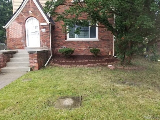 14402 Southfield Rd, Detroit, MI 48223 - view of front of property featuring a front yard and brick siding