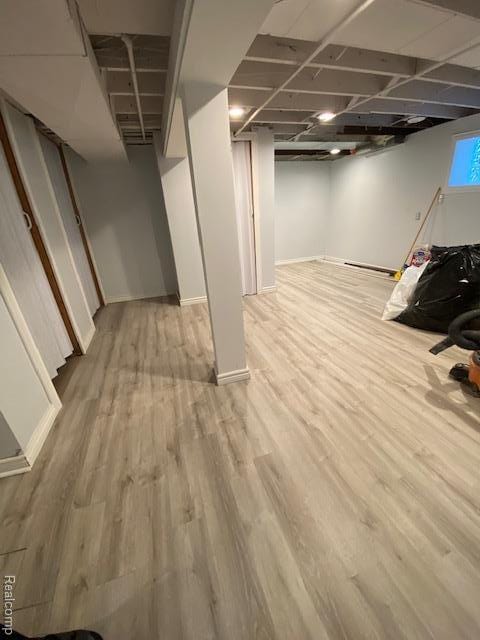 14402 Southfield Rd, Detroit, MI 48223 - below grade area featuring wood finished floors and baseboards