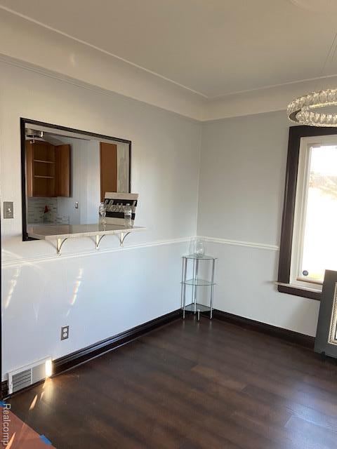 14402 Southfield Rd, Detroit, MI 48223 - empty room with wood finished floors and baseboards