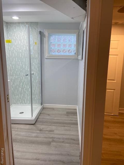 14402 Southfield Rd, Detroit, MI 48223 - corridor featuring wood finished floors and baseboards