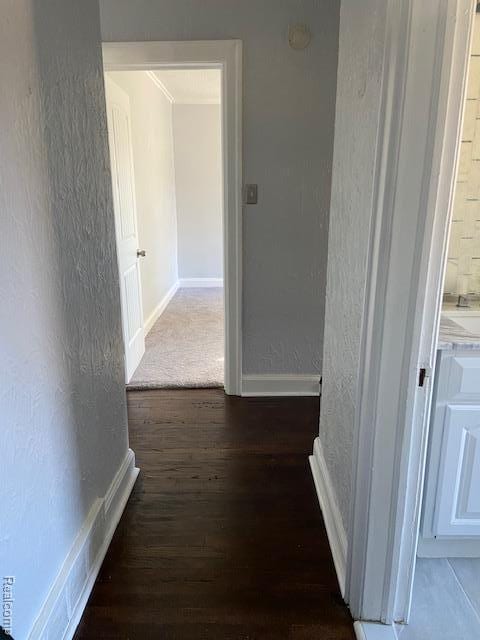 14402 Southfield Rd, Detroit, MI 48223 - hall featuring wood finished floors and a textured wall