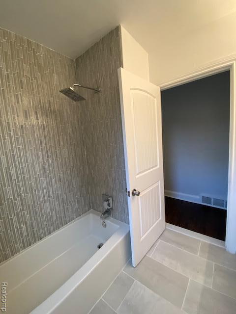 14402 Southfield Rd, Detroit, MI 48223 - bathroom featuring shower / tub combination
