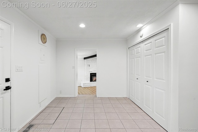4550 Justine St, Shelby Twp, MI 48317 - hallway featuring recessed lighting, light tile patterned floors, and ornamental molding