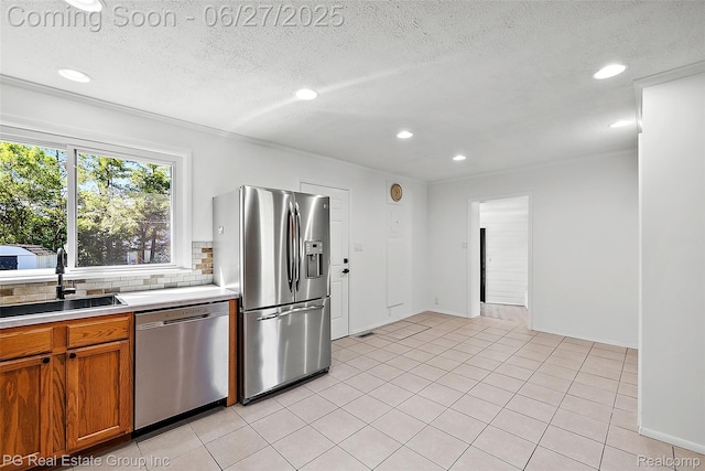 4550 Justine St, Shelby Twp, MI 48317 - kitchen featuring stainless steel appliances, backsplash, light countertops, recessed lighting, and a textured ceiling