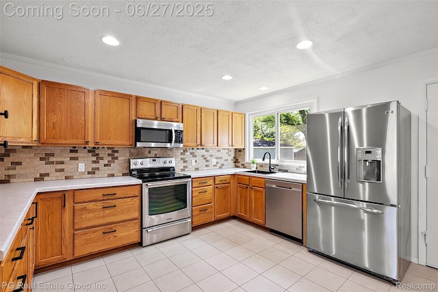 4550 Justine St, Shelby Twp, MI 48317 - kitchen featuring appliances with stainless steel finishes, decorative backsplash, light countertops, a textured ceiling, and brown cabinetry